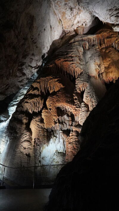 Illuminated rock wall inside a Slovak cave