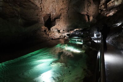 Green-lit water basin with underwater LEDs