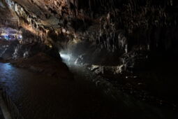 Underground lake in the Prometheus Cave with atmospheric LED lighting and light reflections