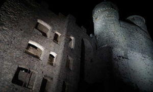 Detail view of the castle tower façade – LED light sets precise accents on stone and structure