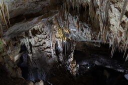 Light projection on stalactites in the Prometheus Cave
