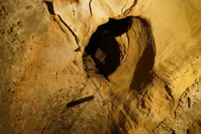 Naturally formed cave shaft with visitor pathway in Cave of the Winds, Colorado, USA