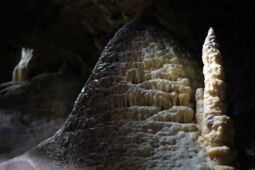 Stalactite figure illuminated by warm LED lighting in Herrmann’s Cave