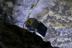 Illuminated rock wall in the Klutert Cave with natural texture