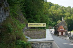 Signposted entrance area of Herrmann’s Cave with LED light