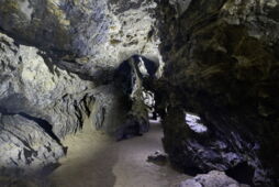 Illuminated passage in the Klutert Cave with atmospheric LED architectural lighting