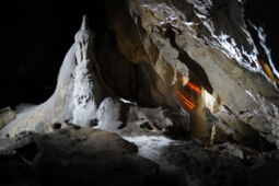 Light reflections along a narrow passage in Herrmann’s Cave