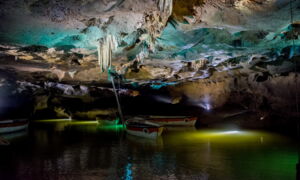 Illuminated boat tour through Coves de Sant Josep with LED light show